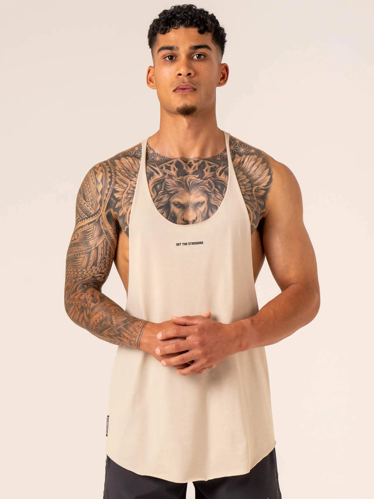 Emerge Arnie T-Back - Sand elastic fabric